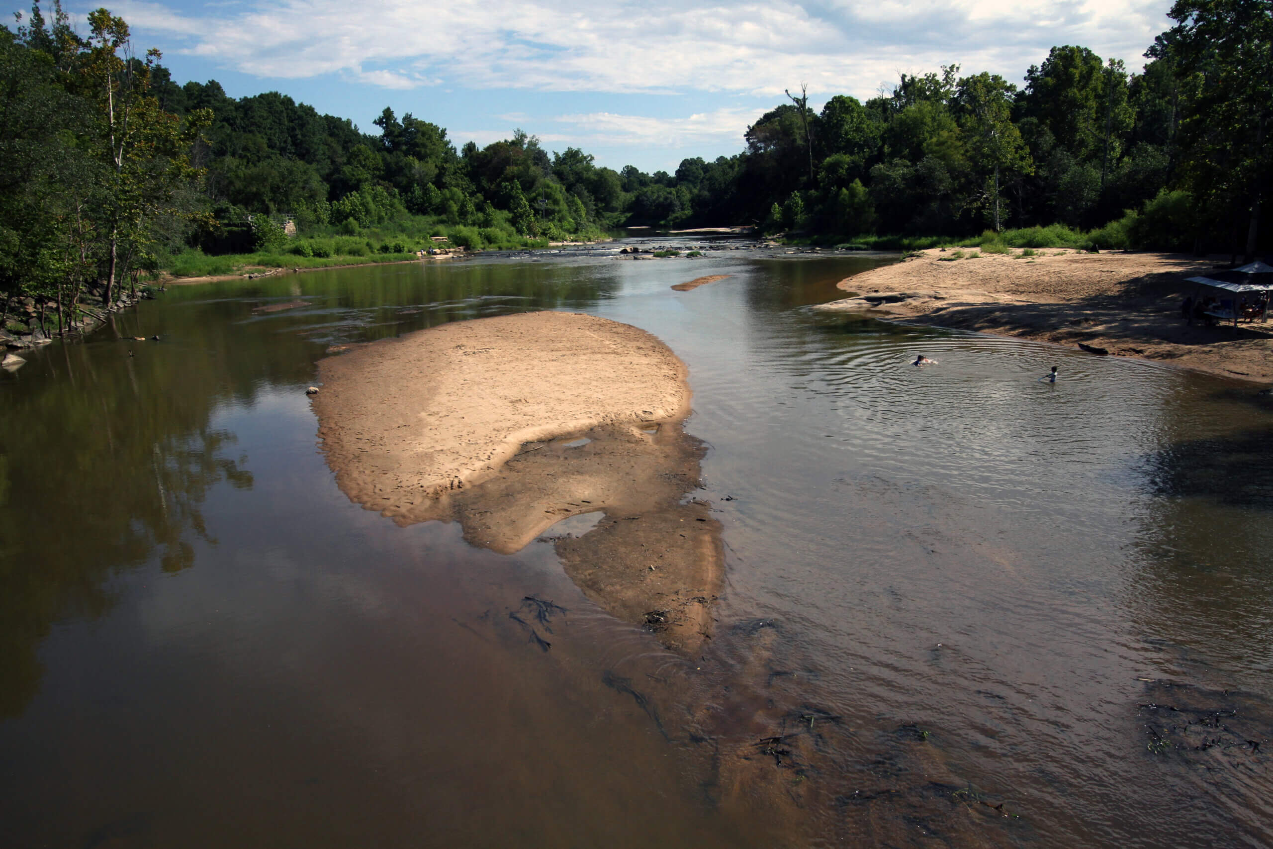 Children play in the clear water of the Neuse along the Neuse Greenway in Raleigh | Veil Stewart Rumley
